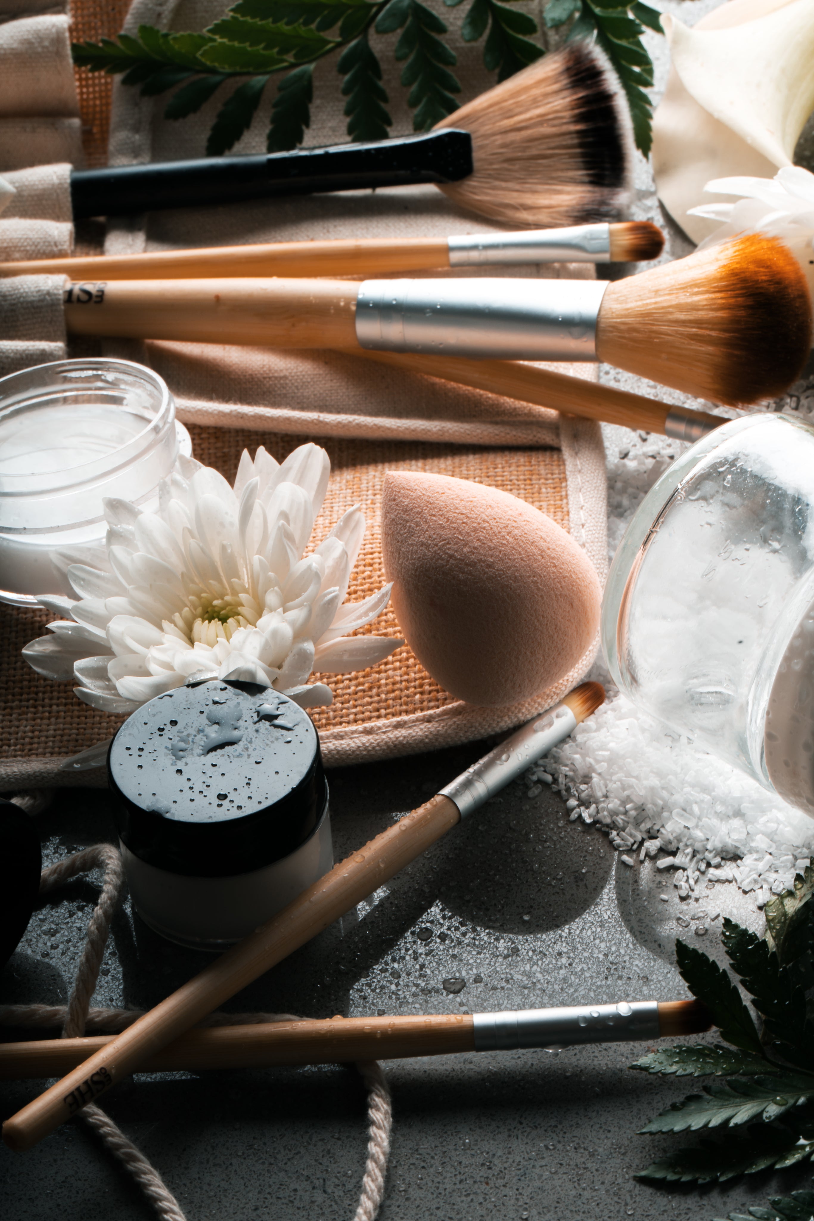 Makeup tools with a white flower